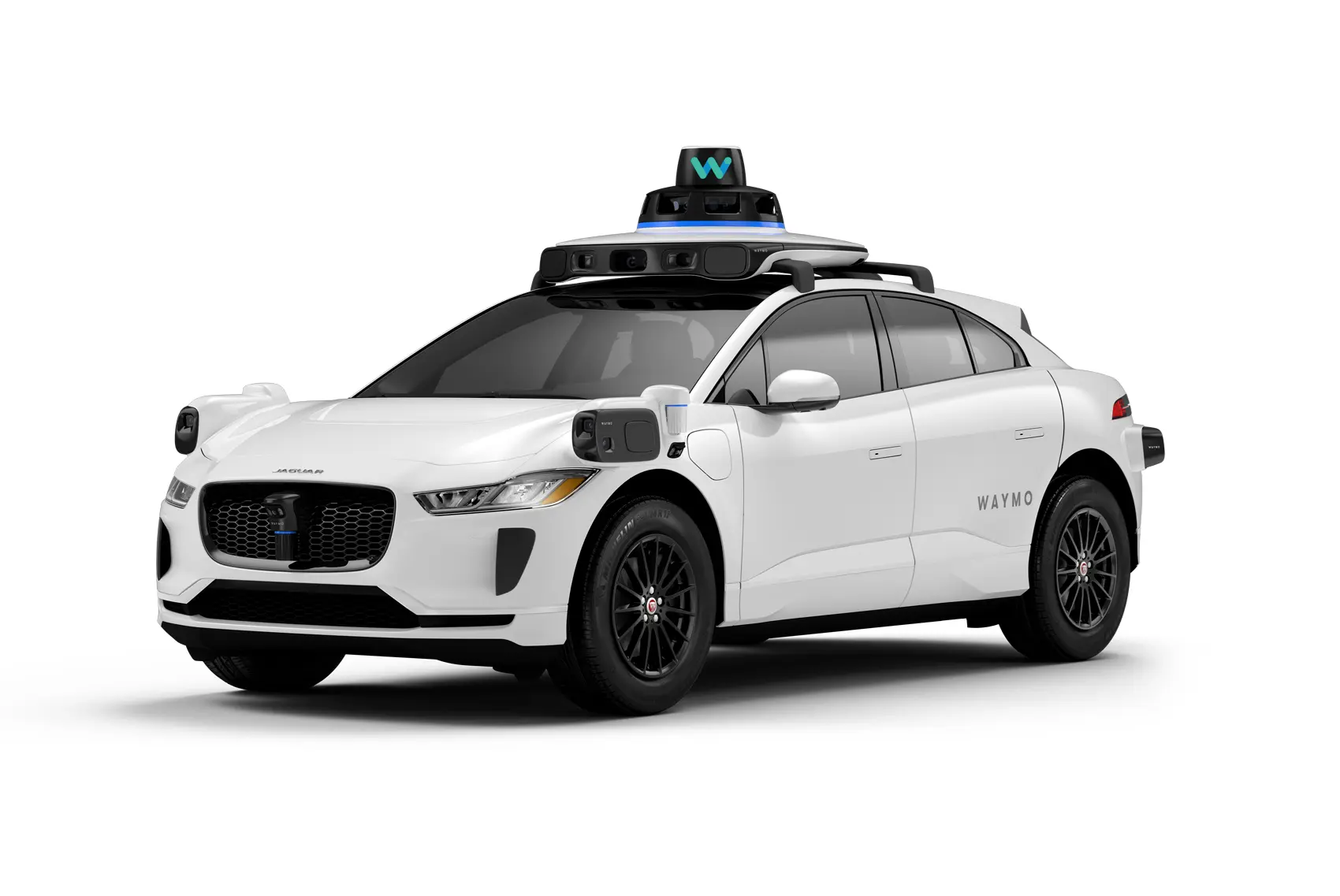 The Waymo Jaguar I-PACE robotaxi, a white autonomous car with sensors mounted on the roof