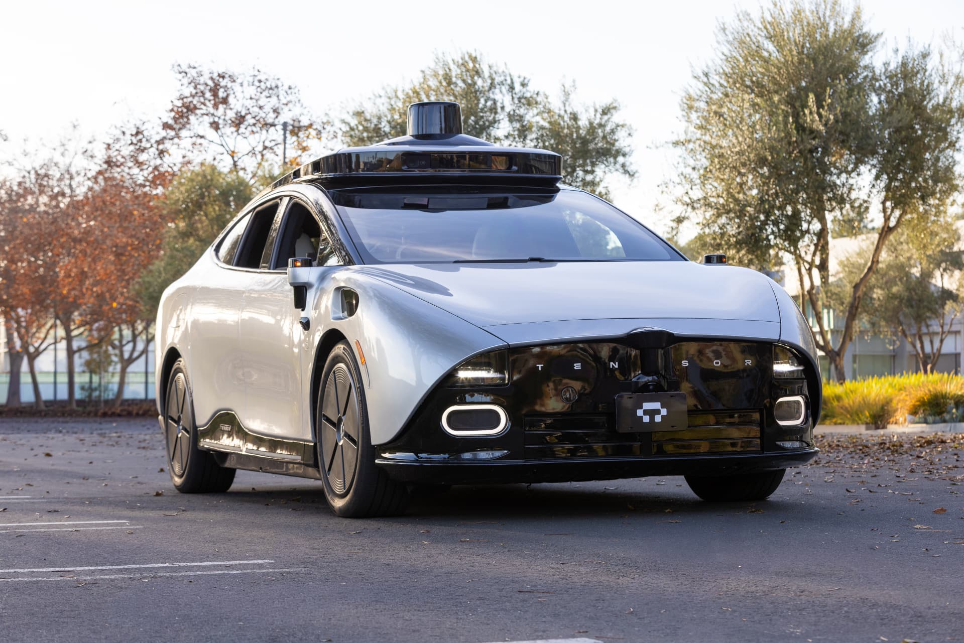 The Tensor Robocar, a silver and black personal autonomous vehicle with roof-mounted sensors