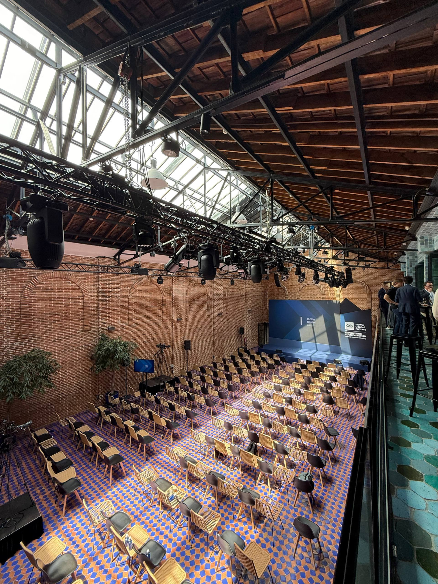 Auditorium seating and stage set up inside La Imprenta